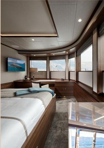 The yacht's cabin lounge with harbour views through large windows